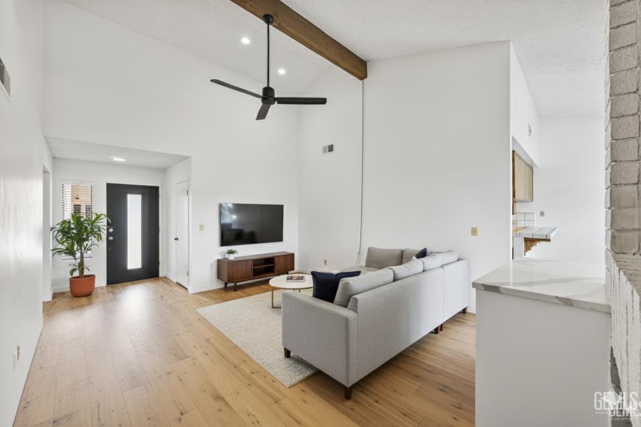 Undisclosed Address Bakersfield, CA 93308 - Photo 35 of 37 a living room with furniture and a flat screen tv