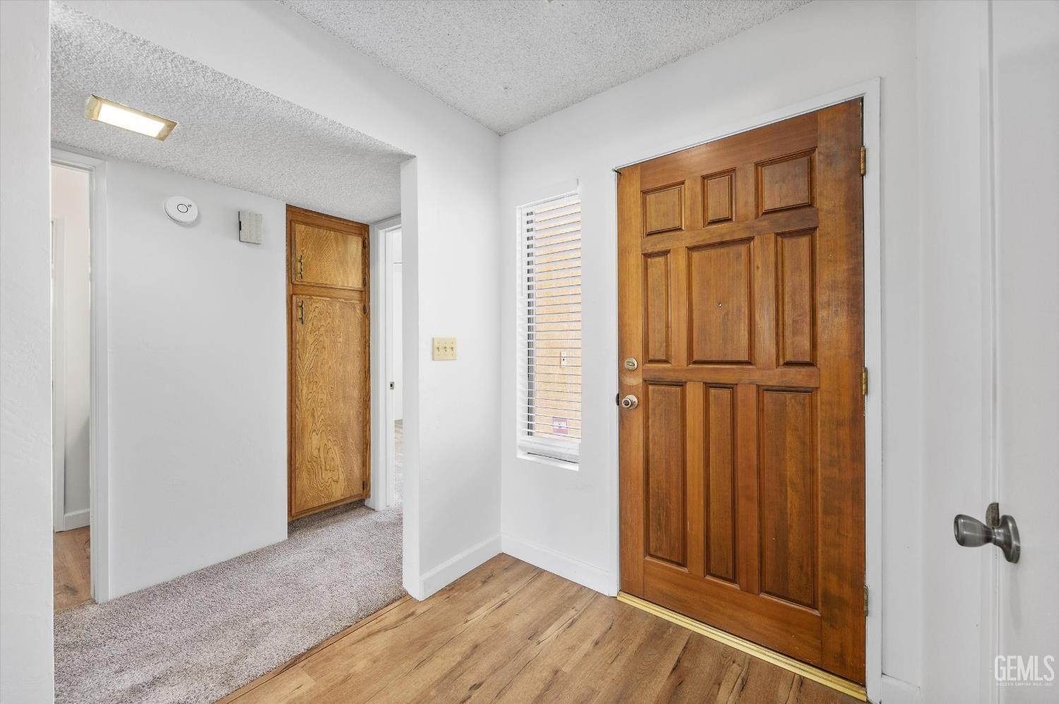 Undisclosed Address Bakersfield, CA 93308 - Photo 6 of 37 an empty room with wooden floor closet and windows