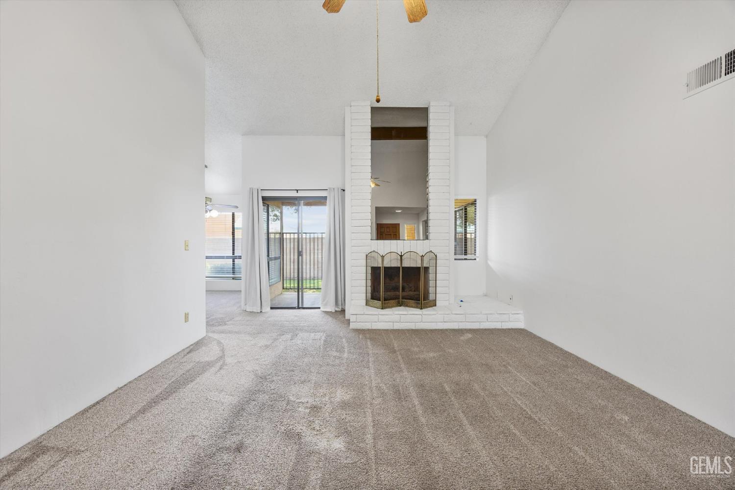 Undisclosed Address Bakersfield, CA 93308 - Photo 7 of 37 a view of a kitchen with furniture and a fireplace