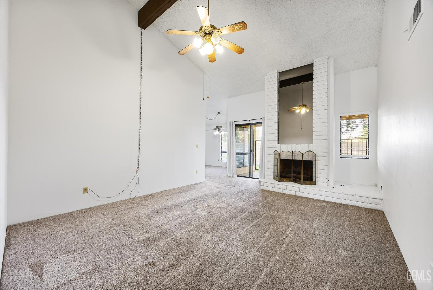 Undisclosed Address Bakersfield, CA 93308 - Photo 8 of 37 a view of a kitchen with a sink and a fireplace