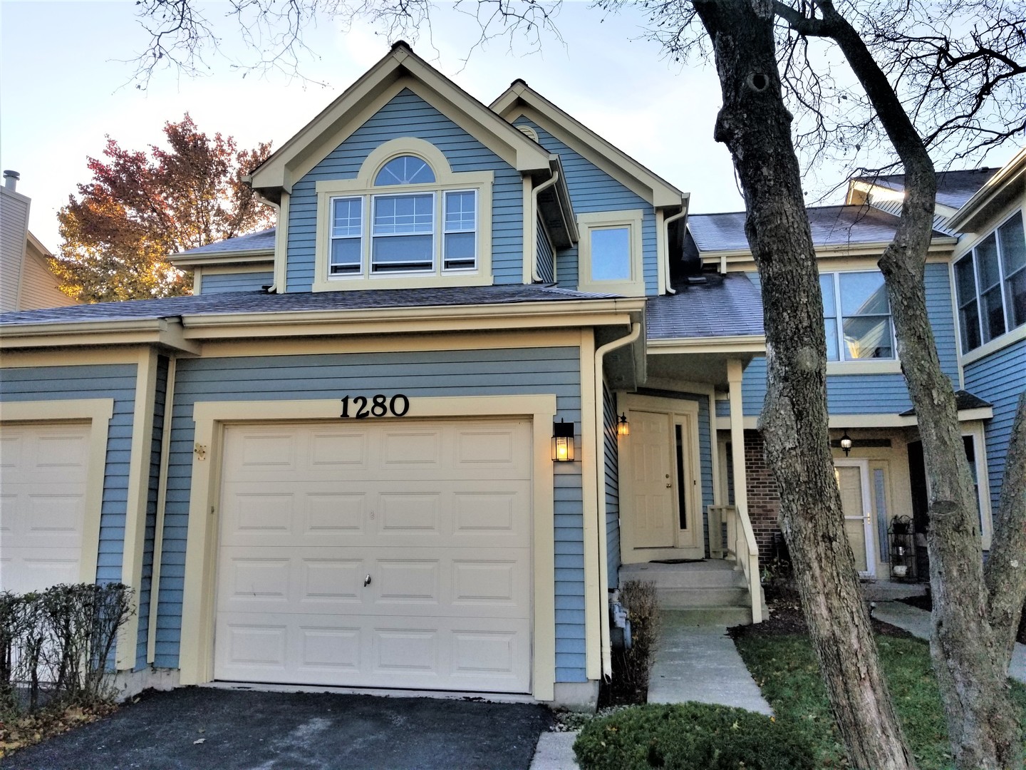 a front view of a house with a garage