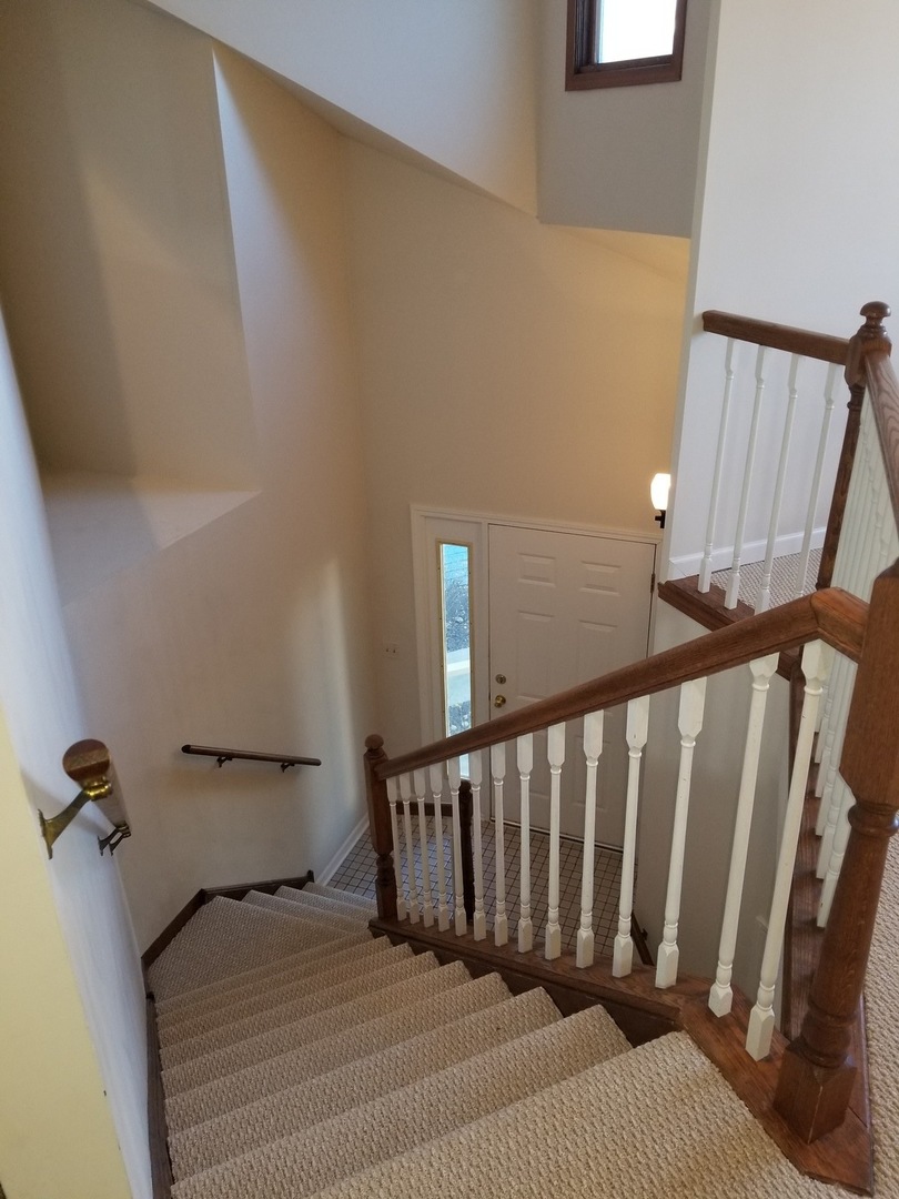 1280 Rhodes Lane, Unit 1280 Naperville, IL 60540 - Photo 3 of 11 a bedroom with a bed and a window