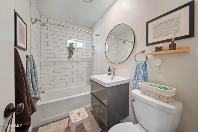 a bathroom with a toilet a sink and a bathtub