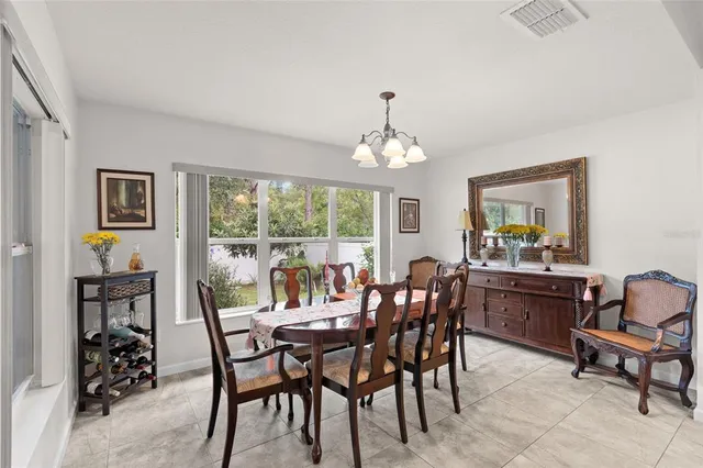 a view of a dining room with furniture window and outside view