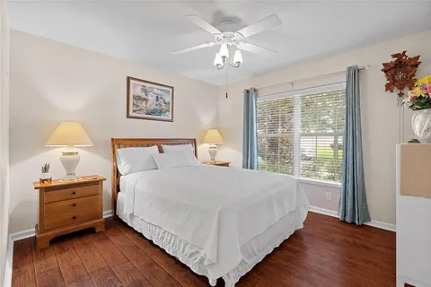 a bedroom with a large bed and a window