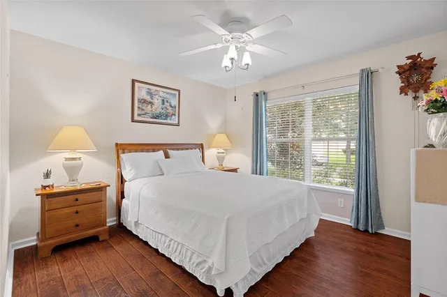 a bedroom with a large bed and a window
