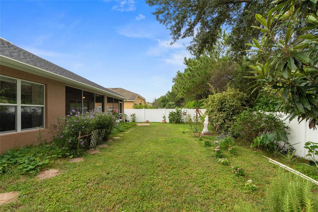 4683 Southwest 40th Place Ocala, FL 34474 - Photo 28 of 43 a front view of a house with a yard