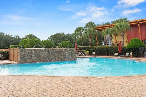 a swimming pool with an outdoor seating
