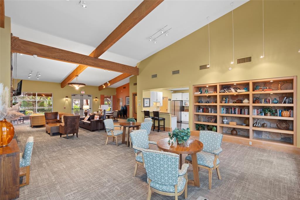 4683 Southwest 40th Place Ocala, FL 34474 - Photo 36 of 43 a living room with furniture and a bookshelf