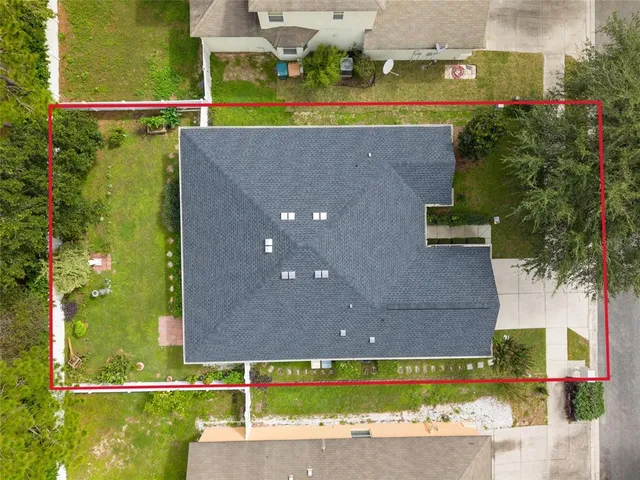 a front view of a house with yard and green space
