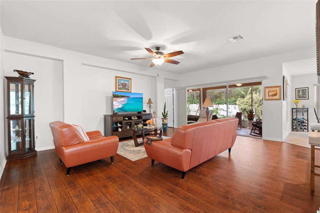 4683 Southwest 40th Place Ocala, FL 34474 - Photo 7 of 43 a living room with furniture and a flat screen tv