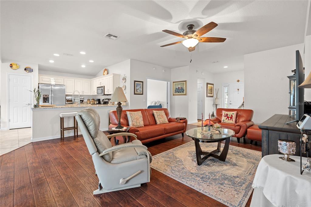 4683 Southwest 40th Place Ocala, FL 34474 - Photo 8 of 43 a living room with furniture and kitchen view