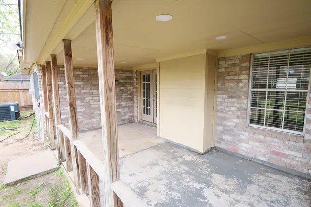 a view of an entryway with wooden floor and door