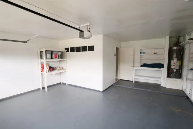a workspace with furniture and white cabinet