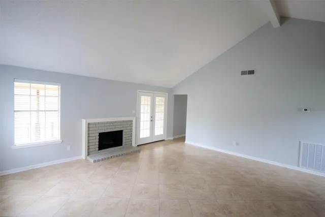 an empty room with fireplace