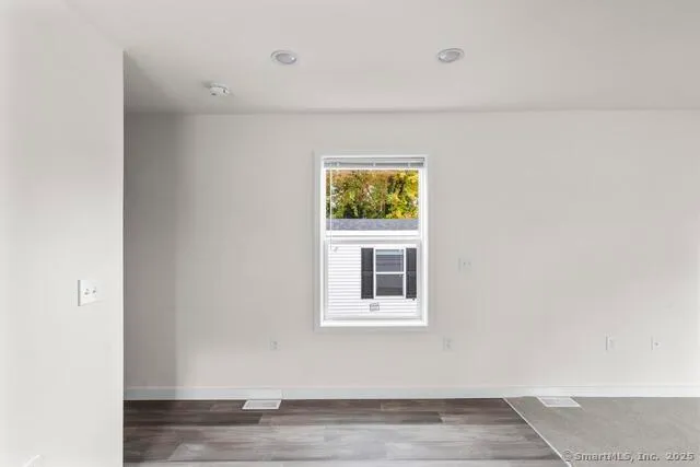 a view of a livingroom and window