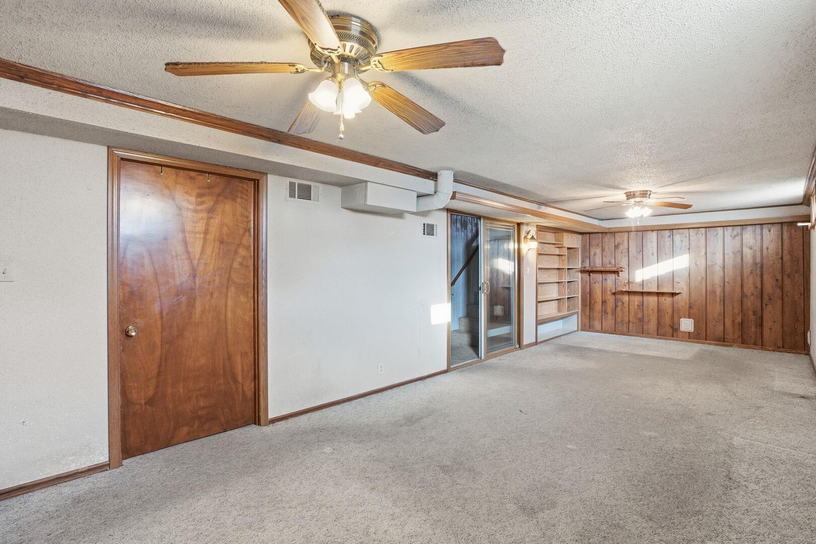 5029 69th Avenue Milan, IL 61264 - Photo 17 of 25 a view of empty room with wooden floor and fan