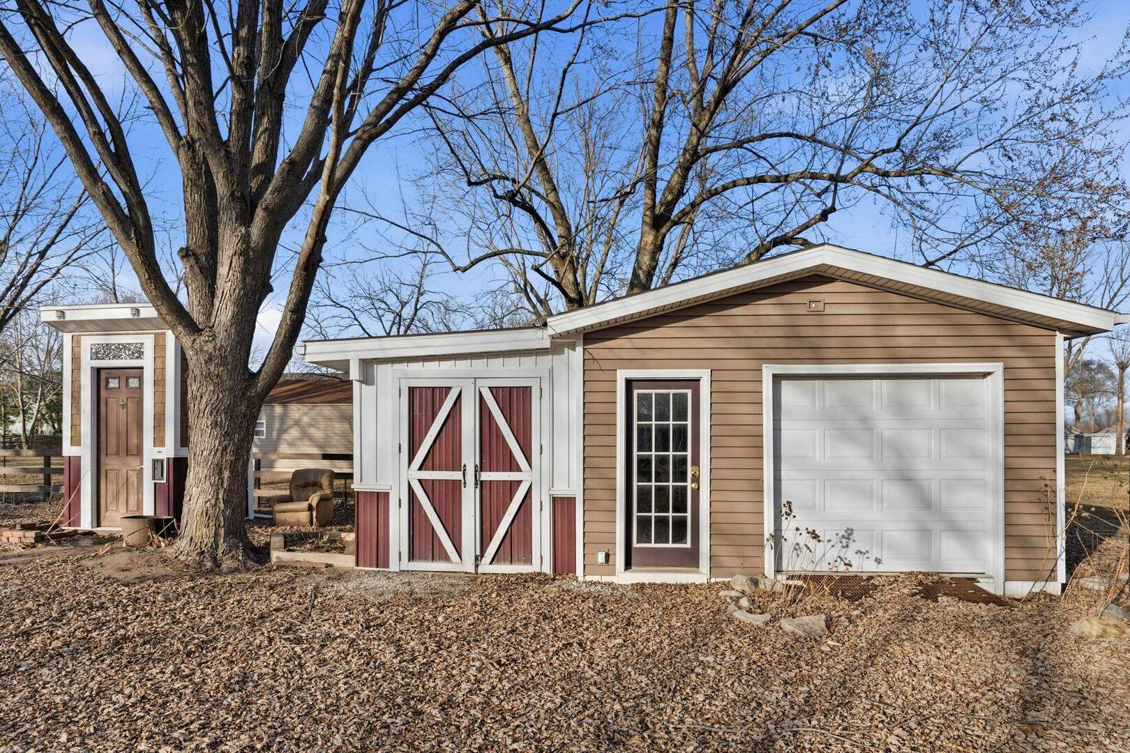 5029 69th Avenue Milan, IL 61264 - Photo 2 of 25 a backyard of a house with barbeque oven table and chairs