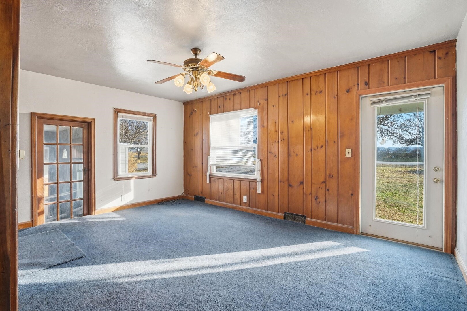 5029 69th Avenue Milan, IL 61264 - Photo 4 of 25 a view of an empty room with a window