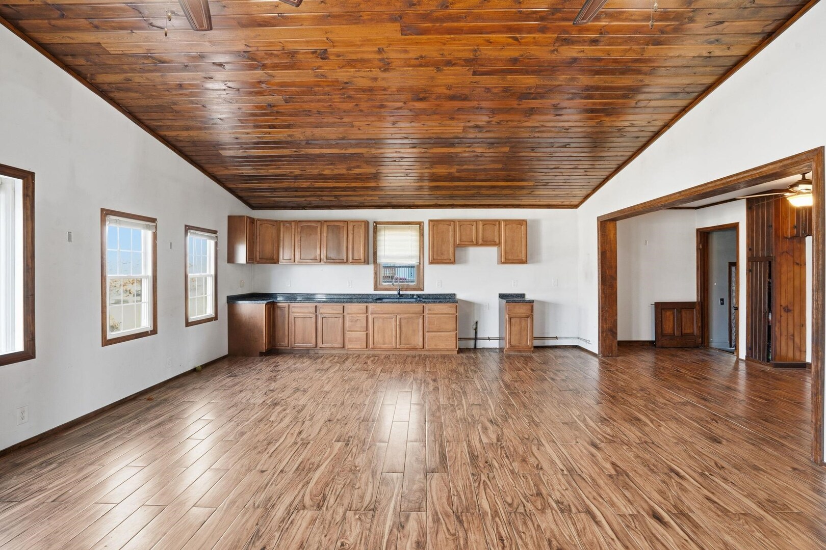 5029 69th Avenue Milan, IL 61264 - Photo 8 of 25 a view of empty room with wooden floor