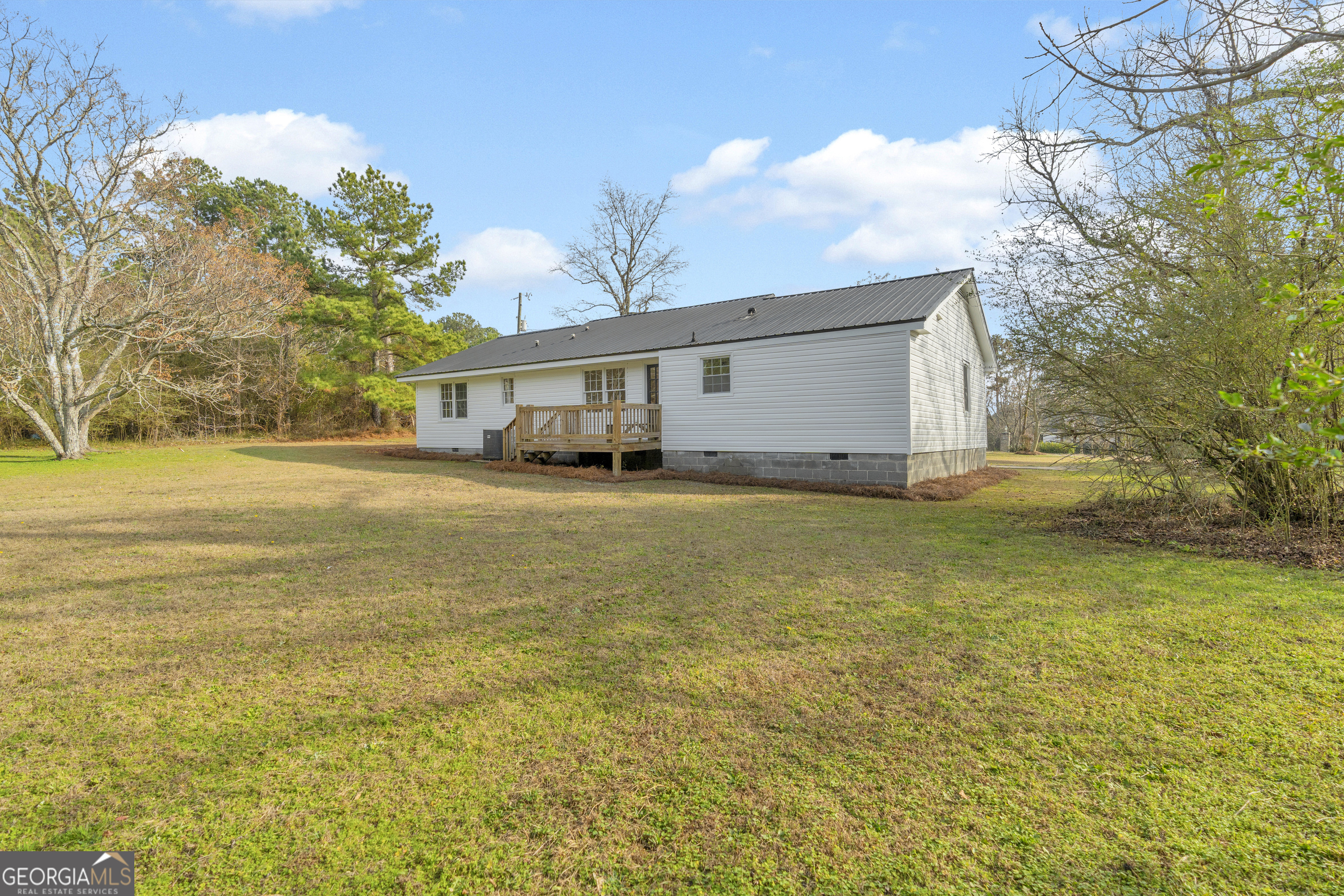 1160 Planing Mill Road Greensboro, GA 30642 - Photo 16 of 76 a view of a yard with a house