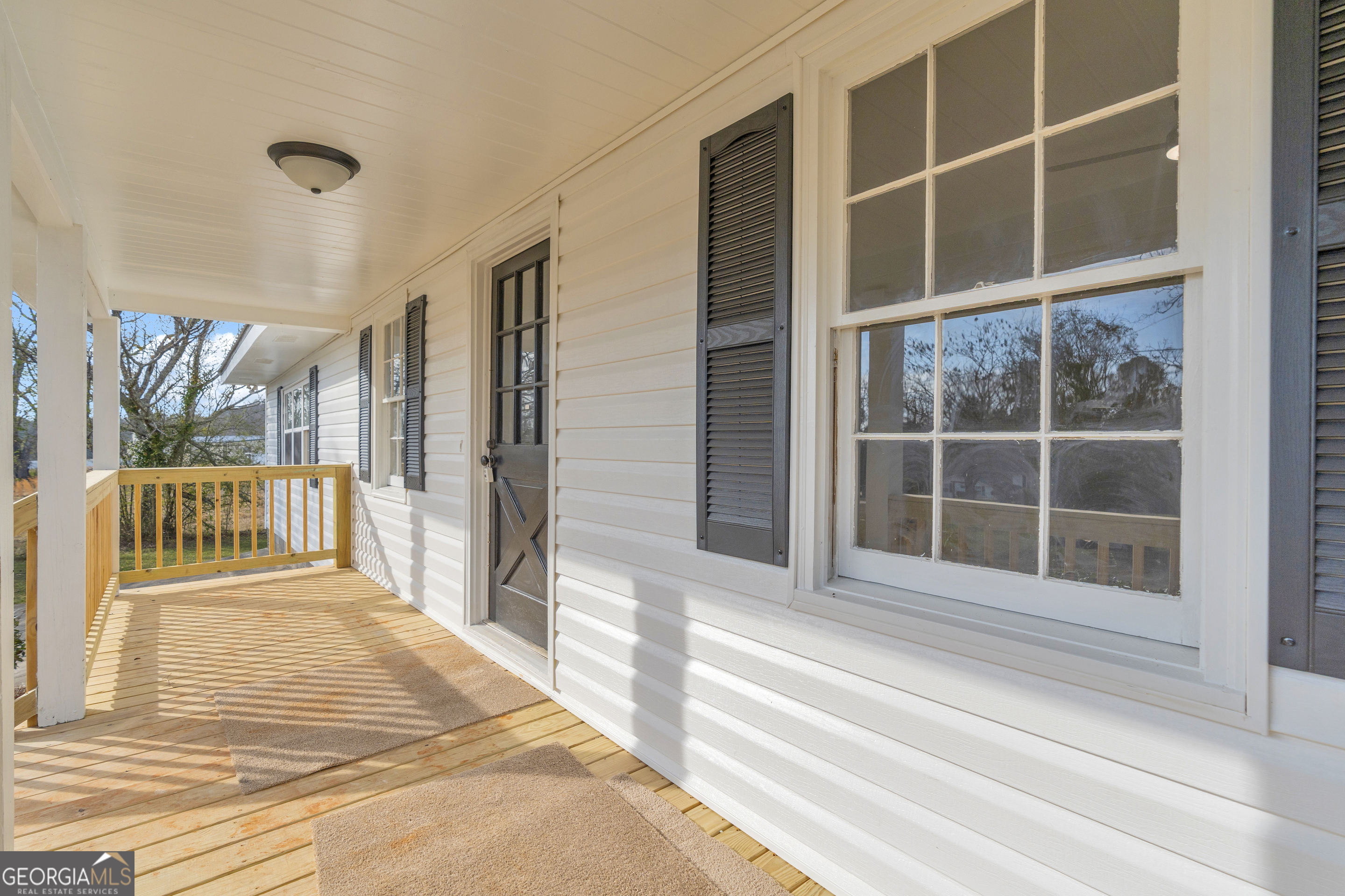 1160 Planing Mill Road Greensboro, GA 30642 - Photo 21 of 76 a bedroom with a bed and a window