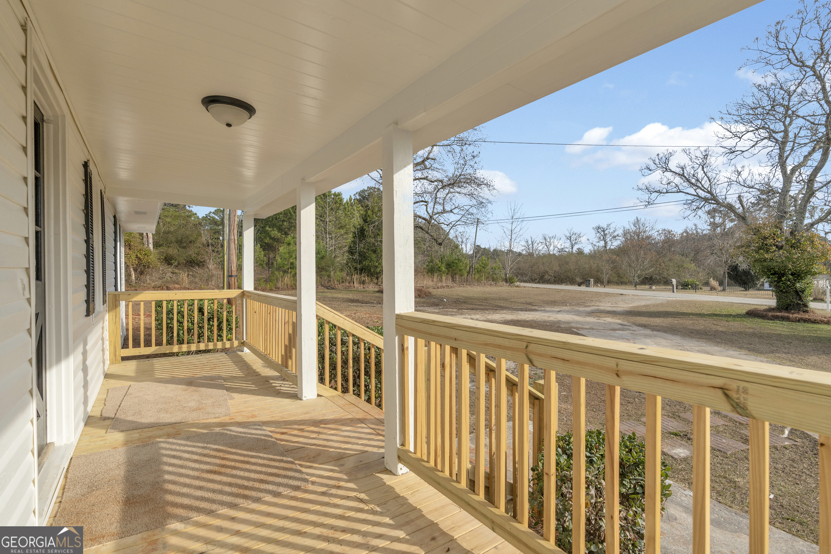 1160 Planing Mill Road Greensboro, GA 30642 - Photo 22 of 76 a view of a balcony with wooden floor