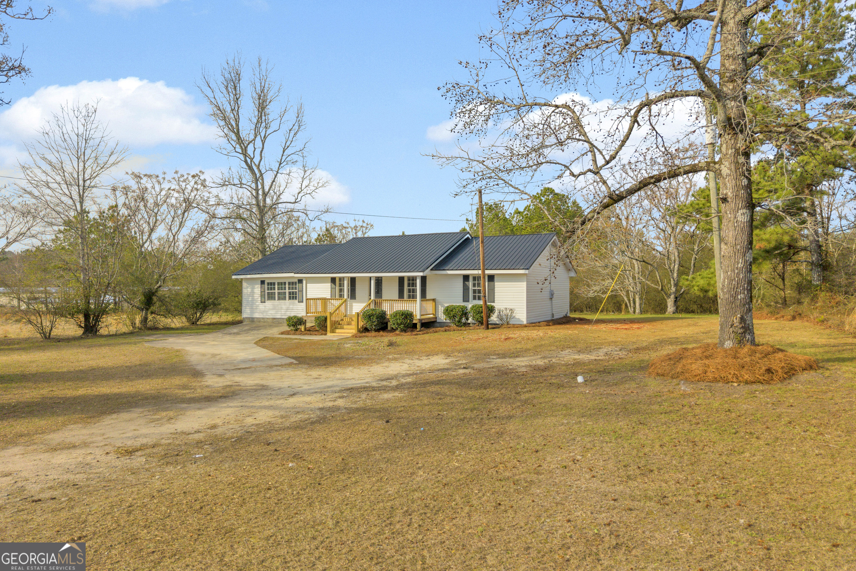 1160 Planing Mill Road Greensboro, GA 30642 - Photo 3 of 76 a front view of a house with a yard