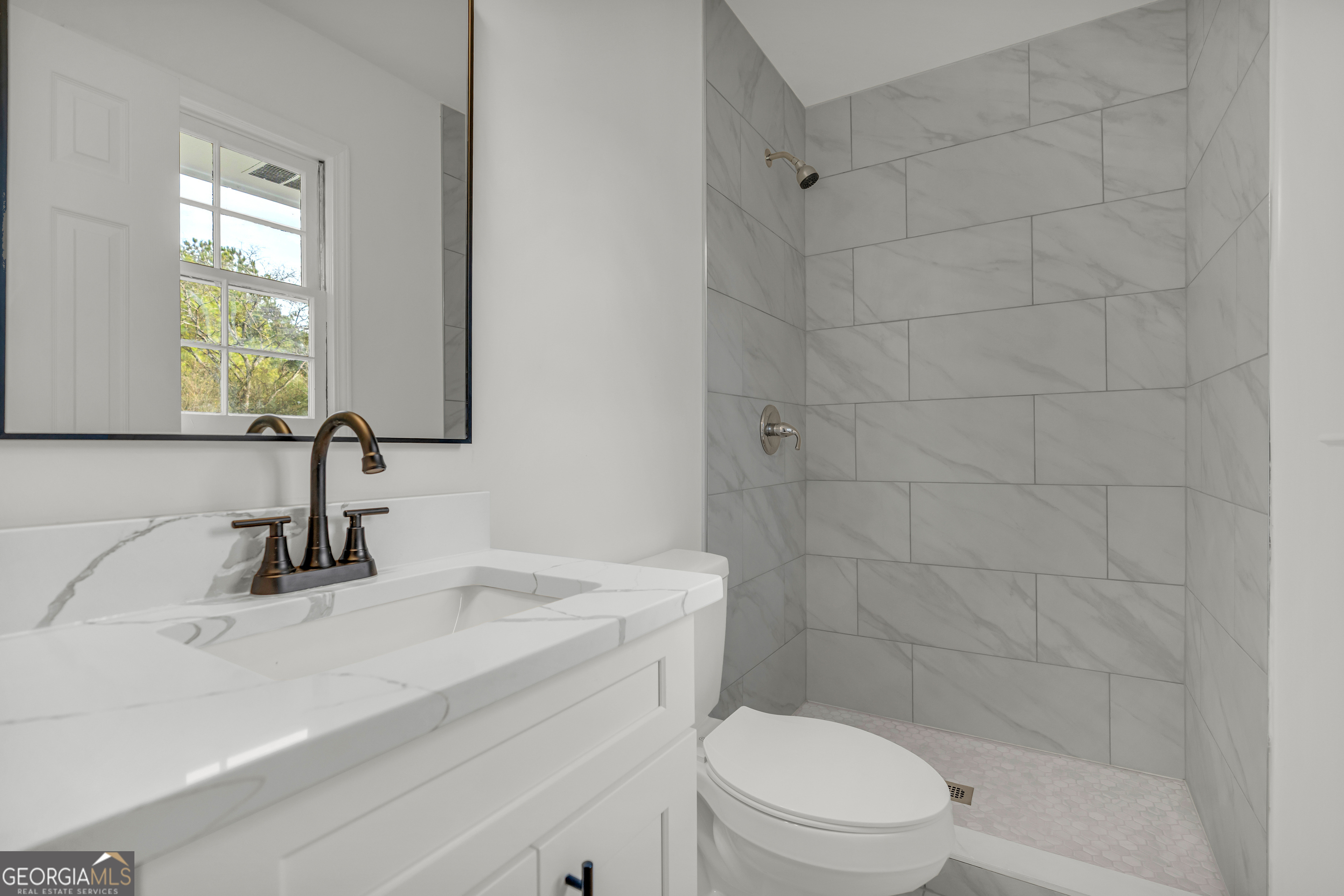1160 Planing Mill Road Greensboro, GA 30642 - Photo 45 of 76 a bathroom with a sink a toilet and shower