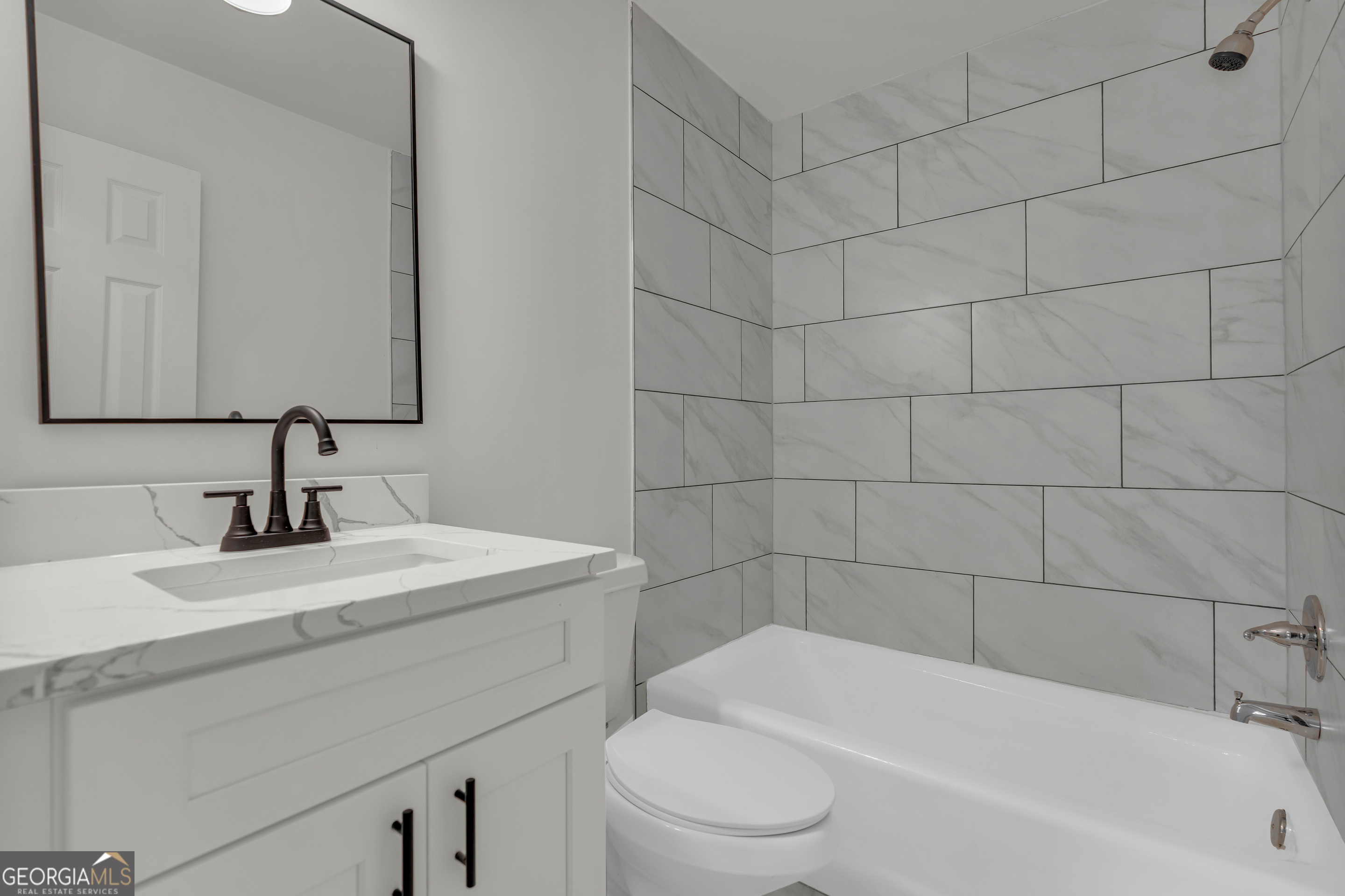 1160 Planing Mill Road Greensboro, GA 30642 - Photo 50 of 76 a bathroom with a sink a toilet and bathtub