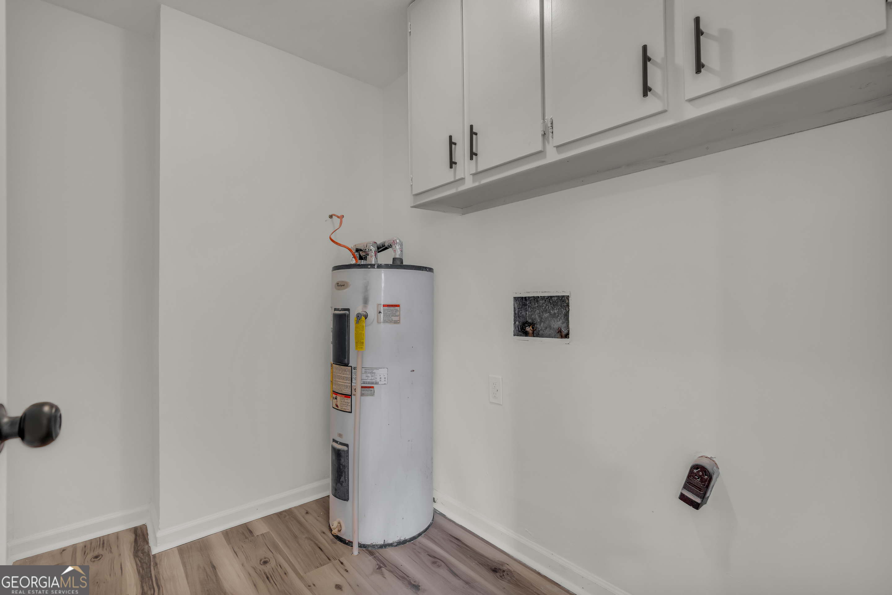 1160 Planing Mill Road Greensboro, GA 30642 - Photo 51 of 76 a view of storage and utility room with wooden floor