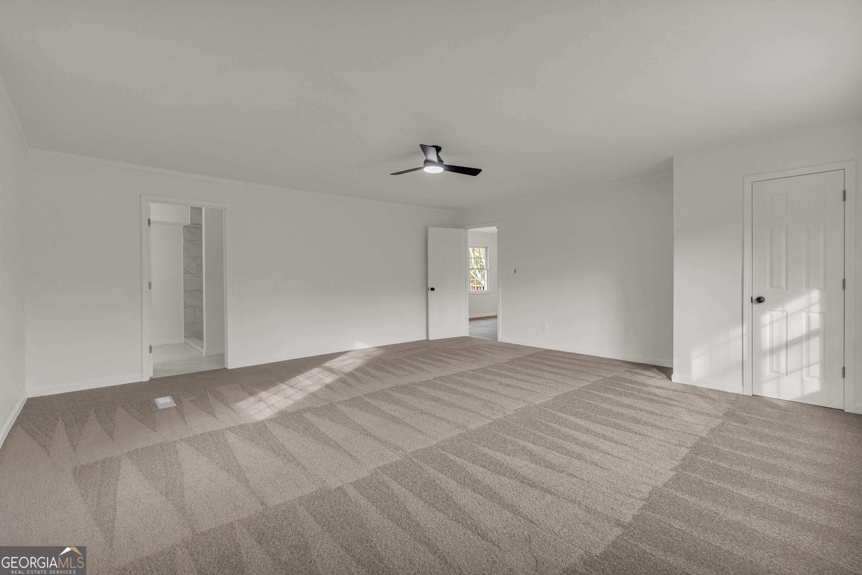 1160 Planing Mill Road Greensboro, GA 30642 - Photo 53 of 76 a view of empty room with a ceiling fan