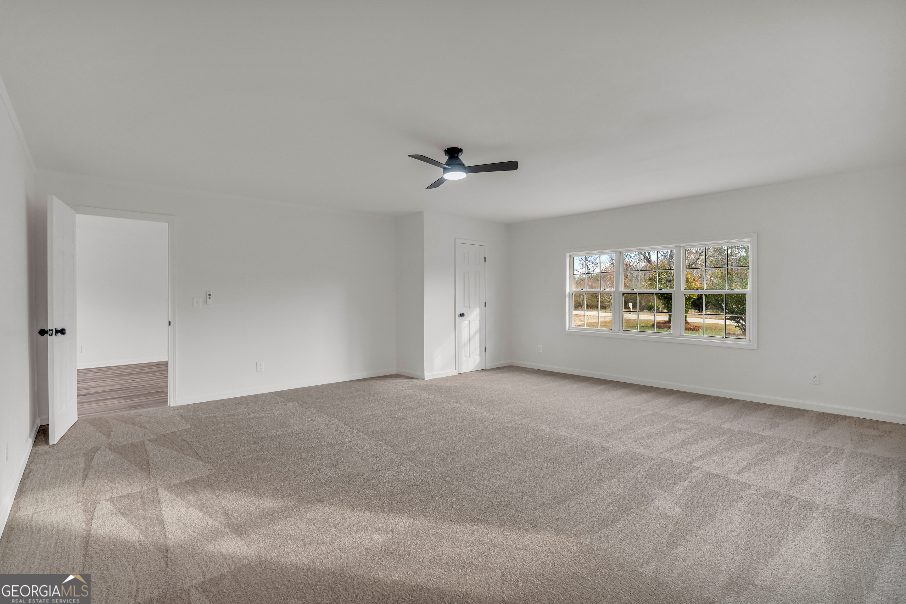 1160 Planing Mill Road Greensboro, GA 30642 - Photo 55 of 76 a view of an empty room with a window
