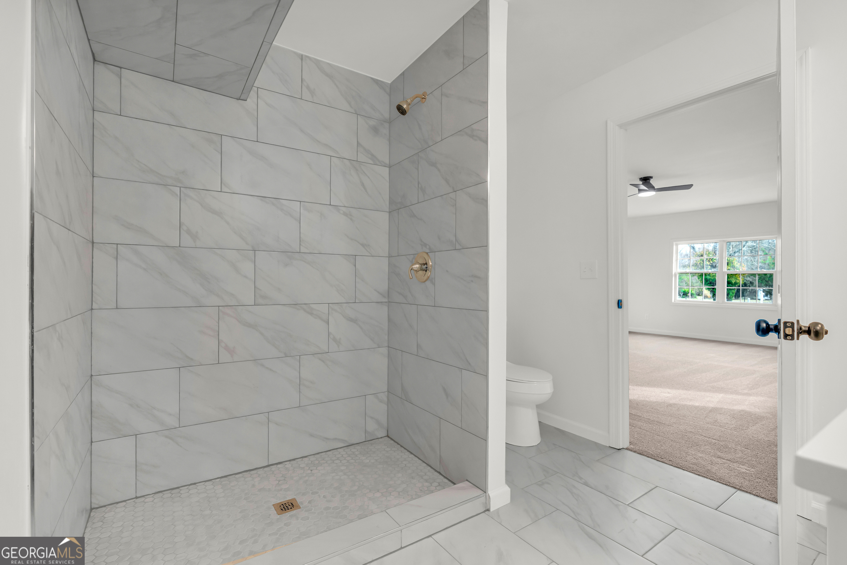 1160 Planing Mill Road Greensboro, GA 30642 - Photo 57 of 76 a bathroom with a granite countertop toilet a sink and shower