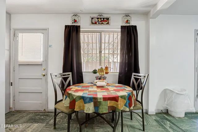 a dining room with furniture and window