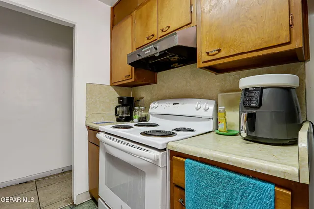 a kitchen with a stove and a microwave