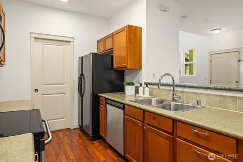 a kitchen with a sink and a refrigerator