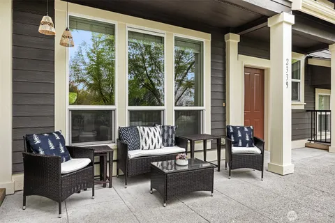 a outdoor living space with furniture and a potted plant