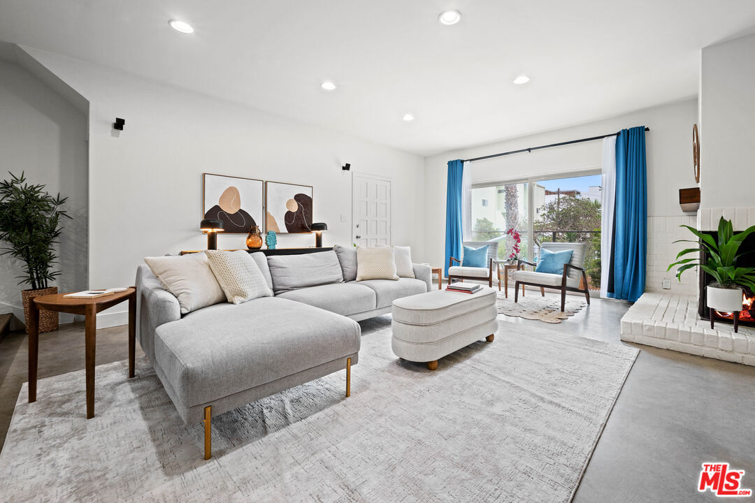 20 Ironsides Street, Unit 8 Marina del Rey, CA 90292 - Photo 2 of 17 a living room with furniture and a large window