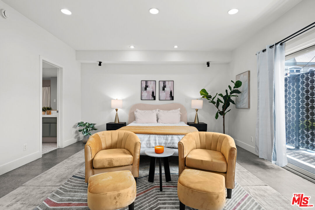 20 Ironsides Street, Unit 8 Marina del Rey, CA 90292 - Photo 8 of 17 a living room with furniture and a large window