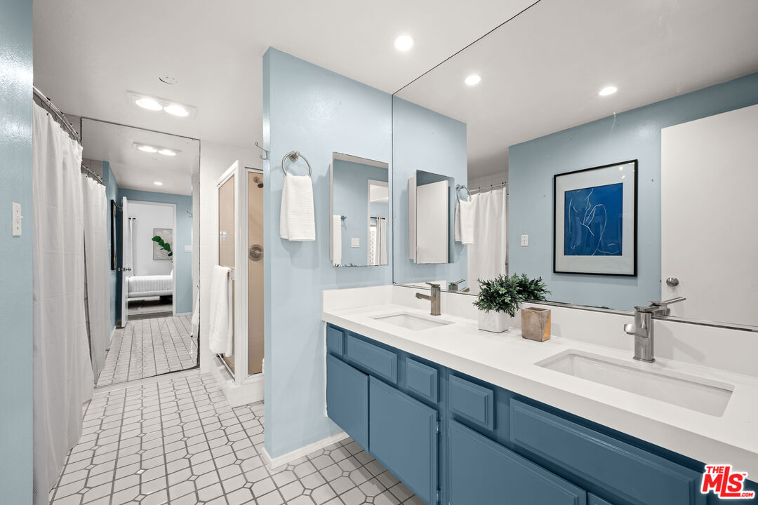 20 Ironsides Street, Unit 8 Marina del Rey, CA 90292 - Photo 10 of 17 a spacious bathroom with a double vanity sink a large mirror a shower and vanity
