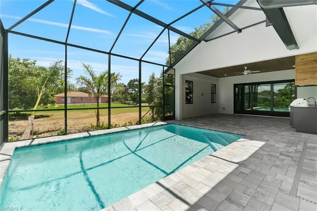 a view of a house with a backyard