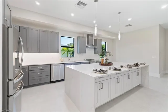 a kitchen with a sink stove and cabinets