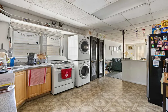 a bedroom with a bed and a television