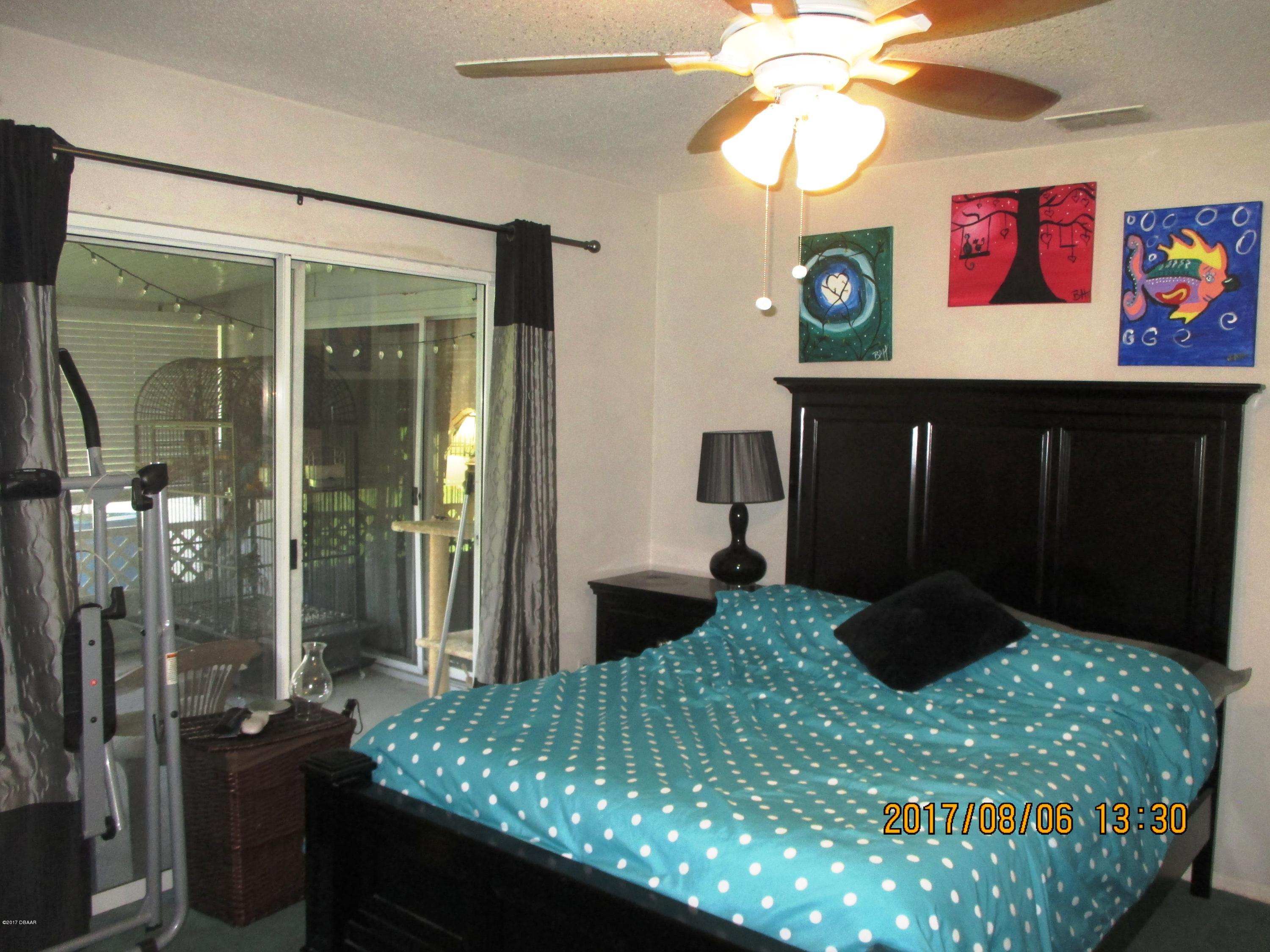 976 Deer Springs Road Port Orange, FL 32129 - Photo 11 of 24 Master room slider view2