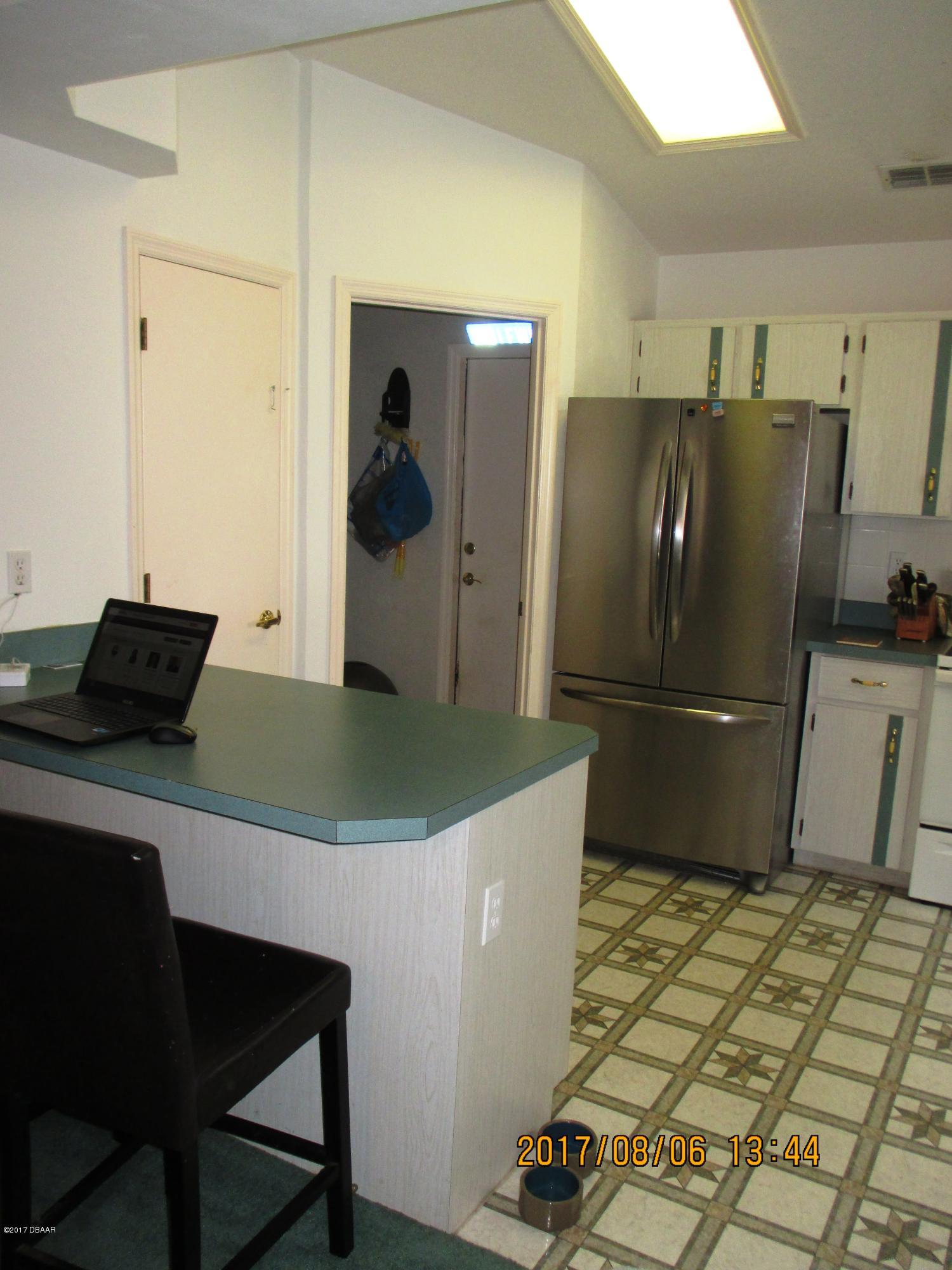 976 Deer Springs Road Port Orange, FL 32129 - Photo 5 of 24 kitchen bar 2