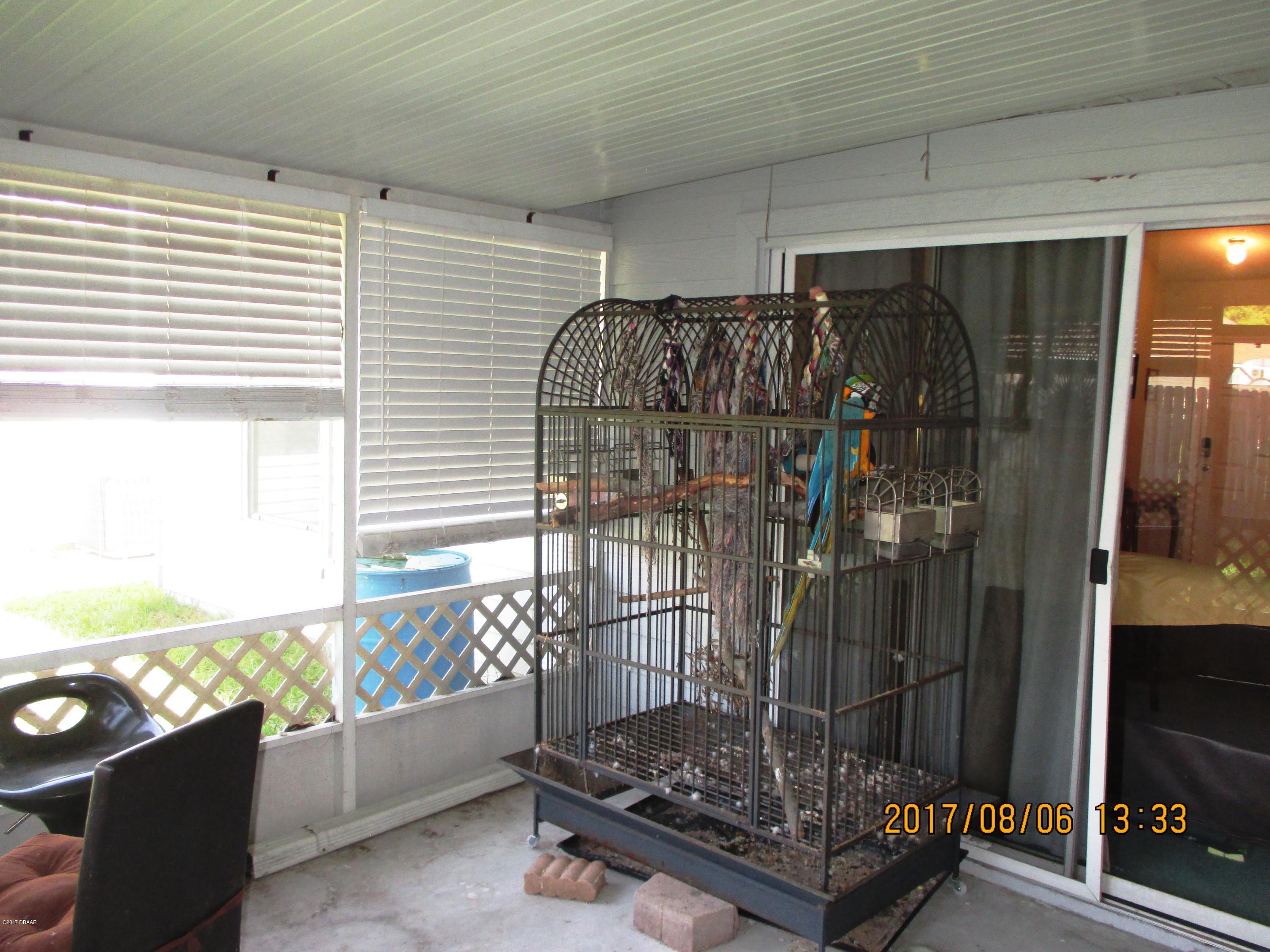 976 Deer Springs Road Port Orange, FL 32129 - Photo 9 of 24 Porch leading to great room