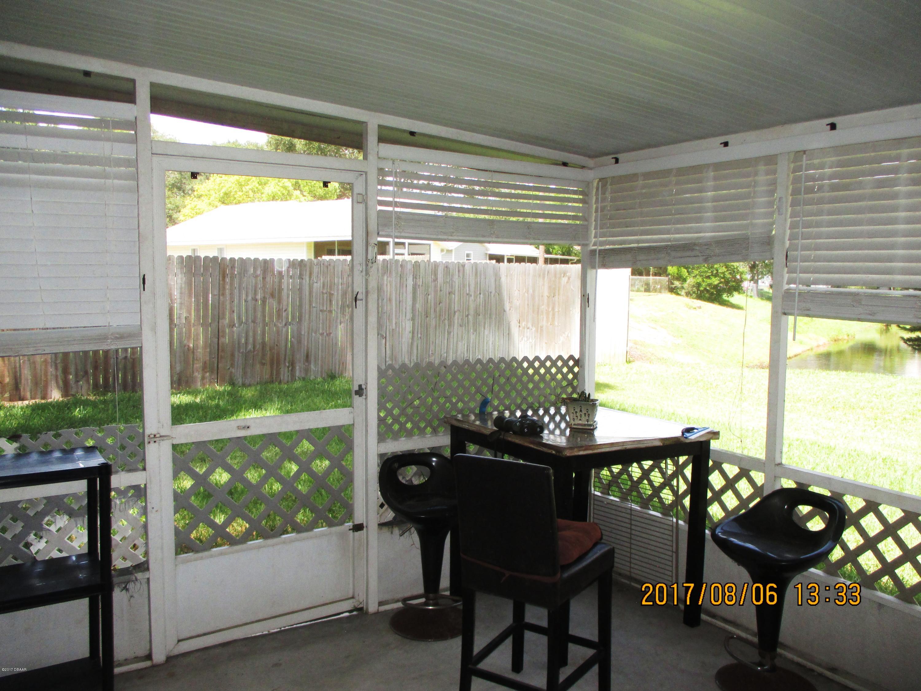 976 Deer Springs Road Port Orange, FL 32129 - Photo 10 of 24 Screen porch