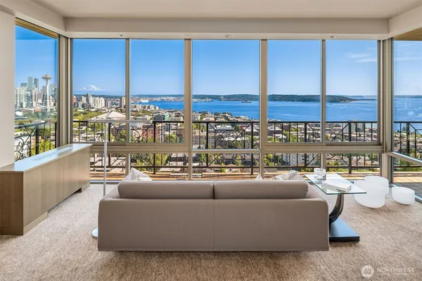 a large kitchen with stainless steel appliances granite countertop a sink and cabinets