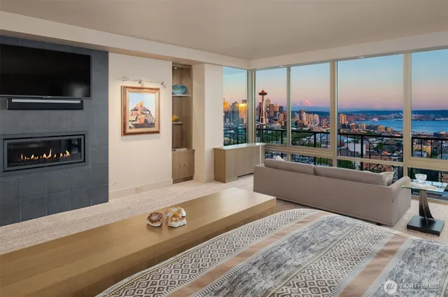 a living room with kitchen island granite countertop furniture and a chandelier